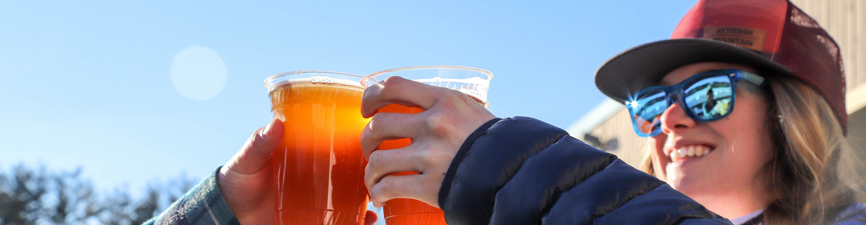 Group of Friends Drink Beer Apres Ski at Attitash