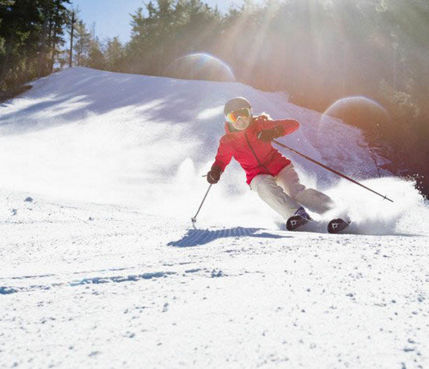 Woman Makes Turns Down Ski Run at Attitash