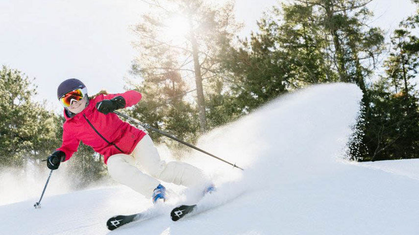 Woman Makes Turns Down Ski Run at Attitash