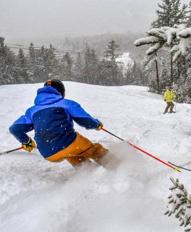 Skier Turns Through Fresh Snow at Attitash