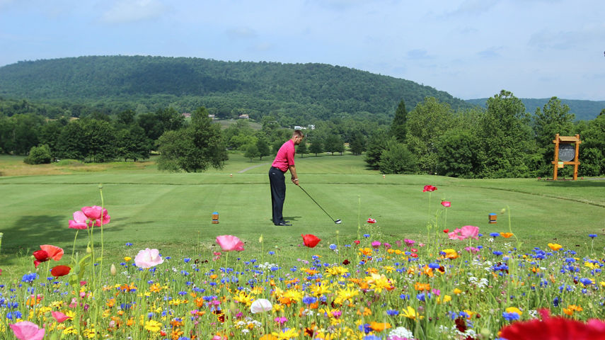 Man Drives a Golf Ball at the Golf Course at Liberty Mountain