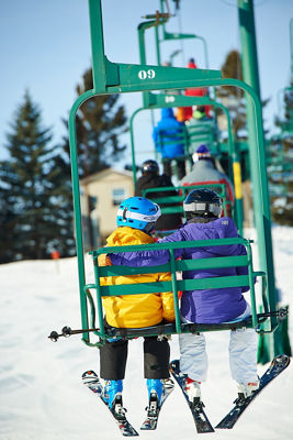 Skiing Family Riding Chairlift In Afton Alps, MN