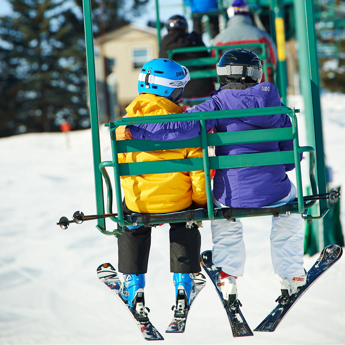 Skiing Family Riding Chairlift In Afton Alps, MN