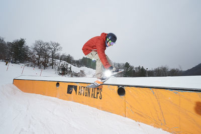 Snowboarder Riding C-Box In LZ Terrain Park In Afton Alps, MN