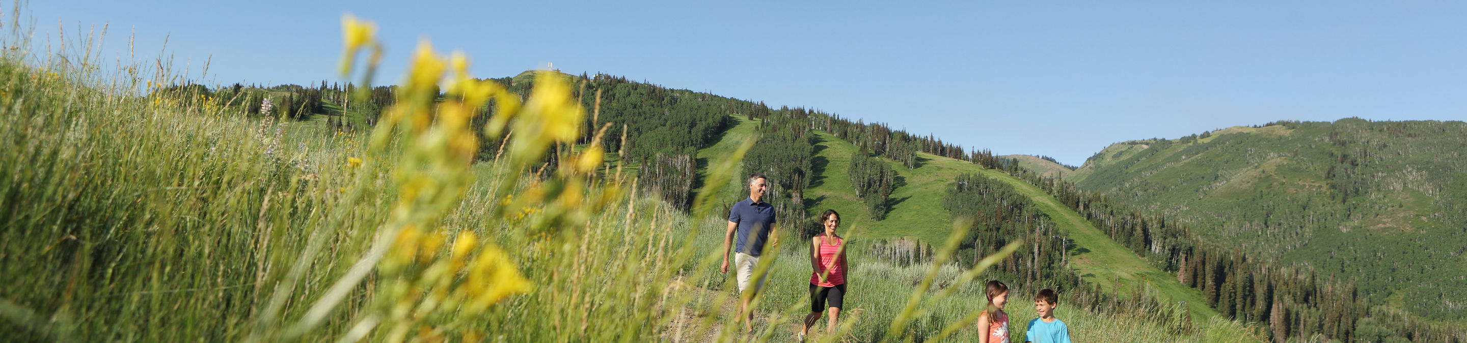 Family Hiking on Mountain in Park City Mountain Resort, UT.