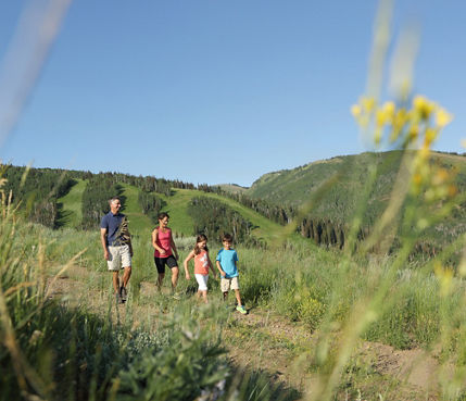 Family Hiking on Mountain in Park City Mountain Resort, UT.