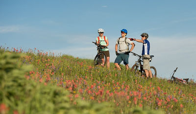Friends Bike on Mountain in Vail, CO.