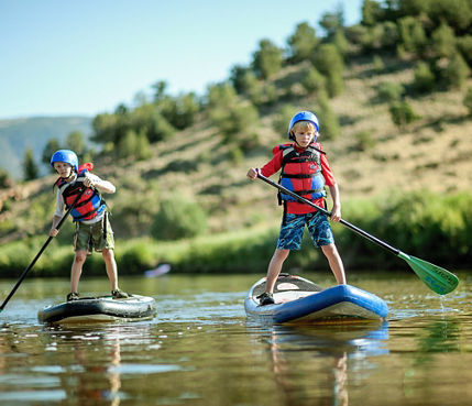 Stand Up Paddleboarding at Kids Camp in Beaver Creek, CO.