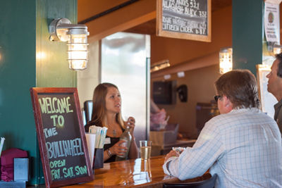 Men Order Drinks with Bartender at the Bullwheel at Mount Snow