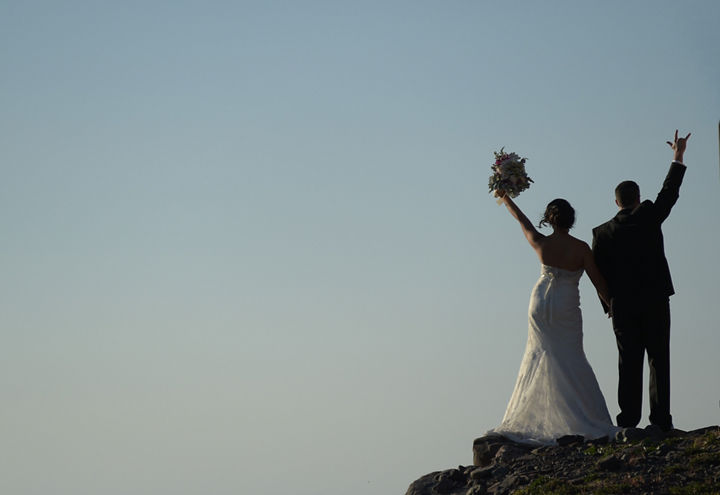 Bride and Groom Look Out Over Top of Hunter Mountain