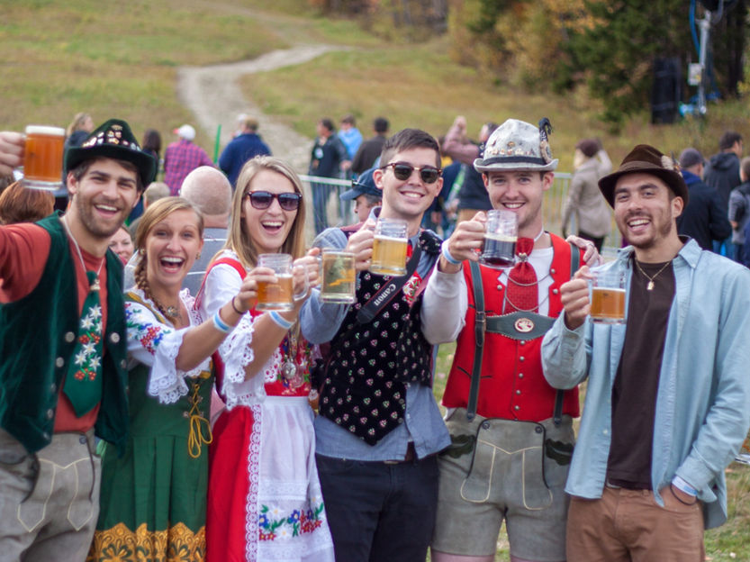 Group of Friends Raises Beers at Oktoberfest at Mount Snow