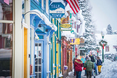 Snow covered storefronts in the village at Crested Butte, CO.