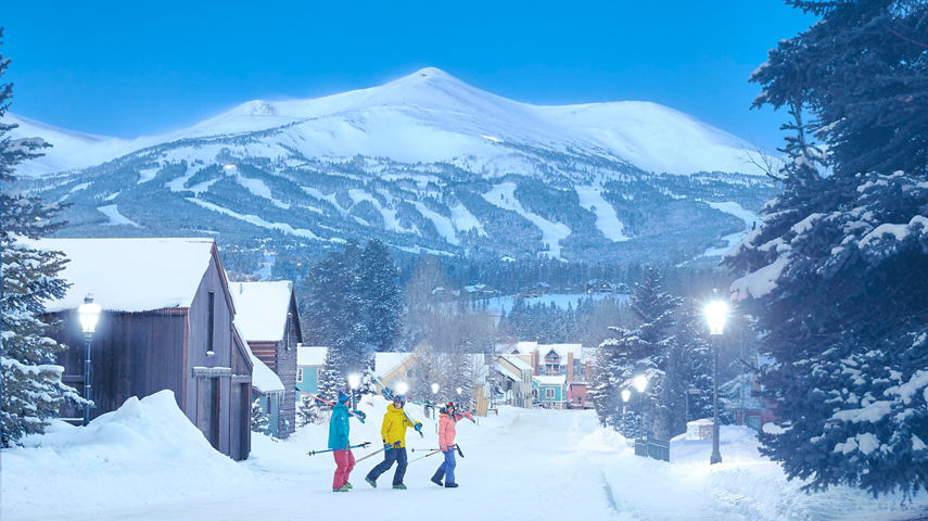 Friends walk across Lincoln Street at Dawn at Breckenridge