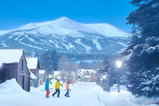 Friends walk across Lincoln Street at Dawn at Breckenridge