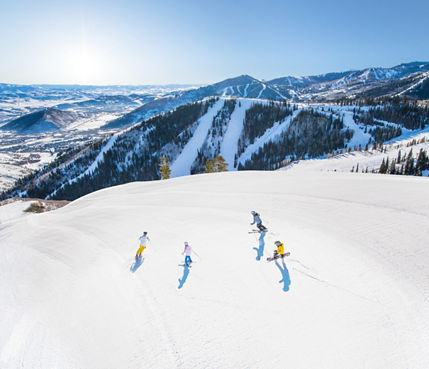 A family skis Apex Ridge in Park City, UT.