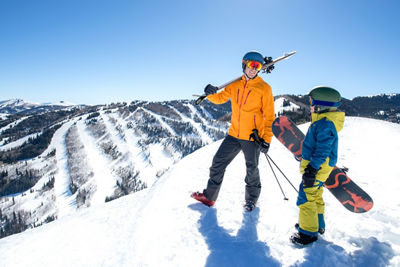A father and son enjoy a scenic vista on Pinecone Ridge in Park City, UT.
