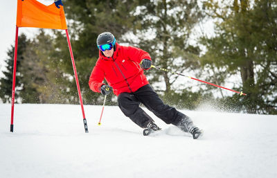 Adult Skier Racing Gates In Afton Alps, MN.