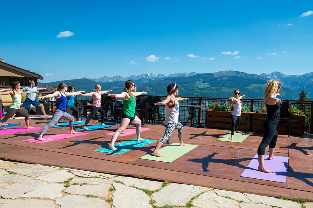 Yoga at Mid-Vail Deck on Mountain in Vail, CO.