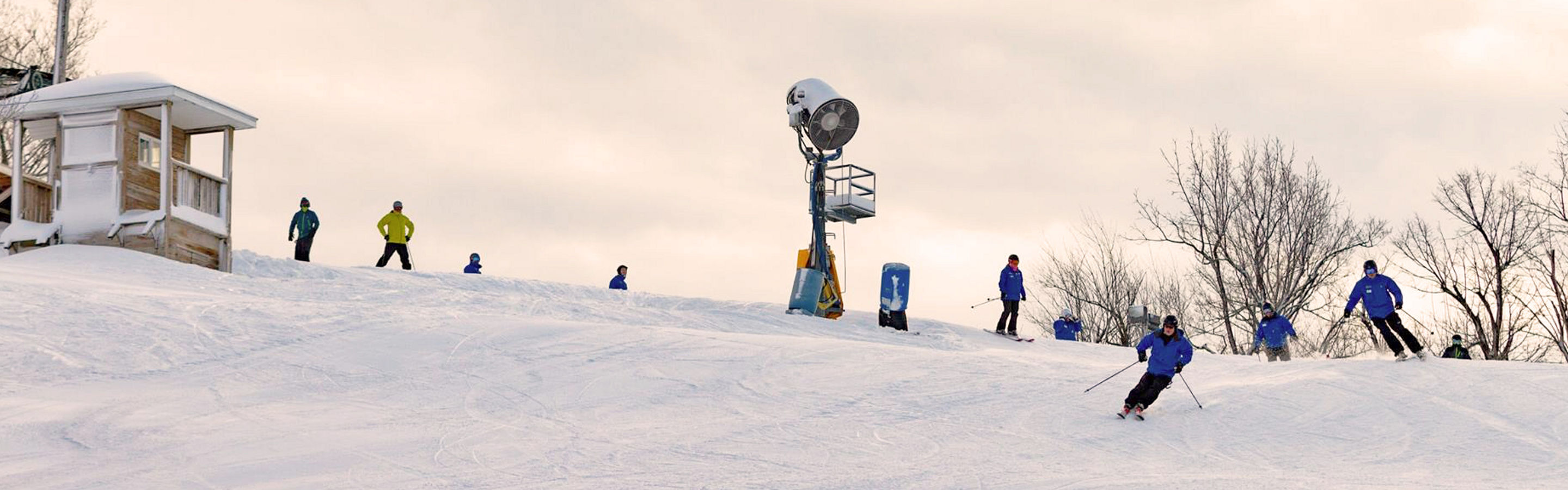 Skiers Make Turns Downhill at Mar River Mountain