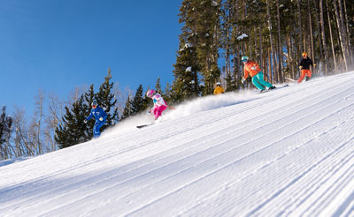 Family skis with a private mountain Mountain Host at Beaver Creek, CO.