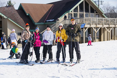 Group of Skiers Poses at Base Area at Boston Mills