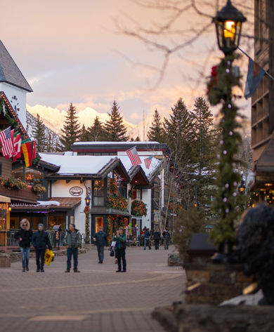 Vail's iconic village with the Gore Range Mountains capturing the sunset in Vail, CO.