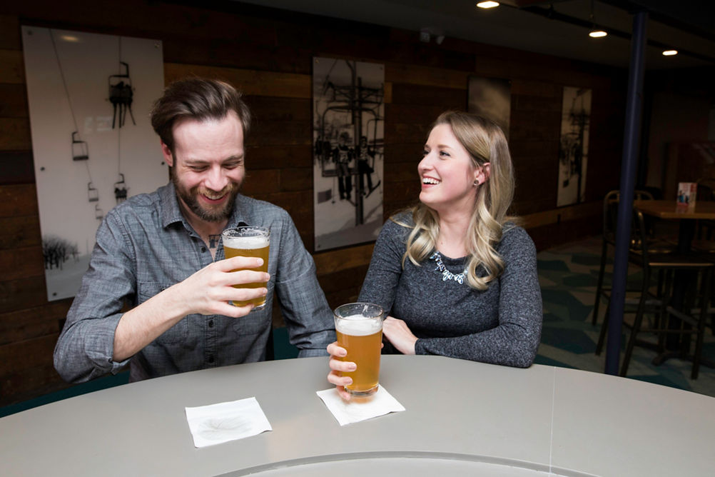Couple enjoys a beverage at Ski Hill Grill Bar in Wilmot Mountain