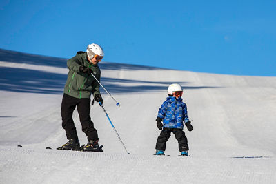 Family skiing and snowboarding at Wilmot Mountain
