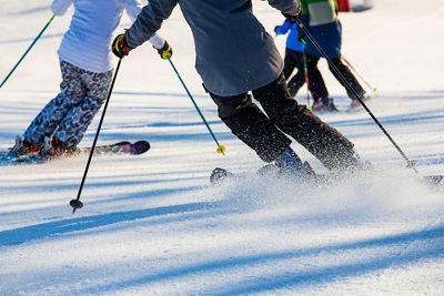 Family skis at sunrise in Wilmot Mountain