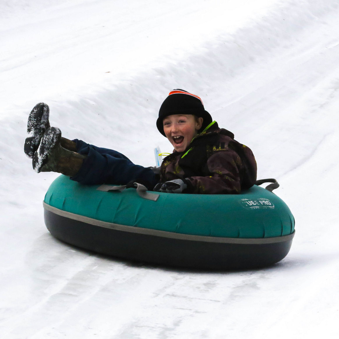 Little Boy Tubes Downhill at Mount Snow