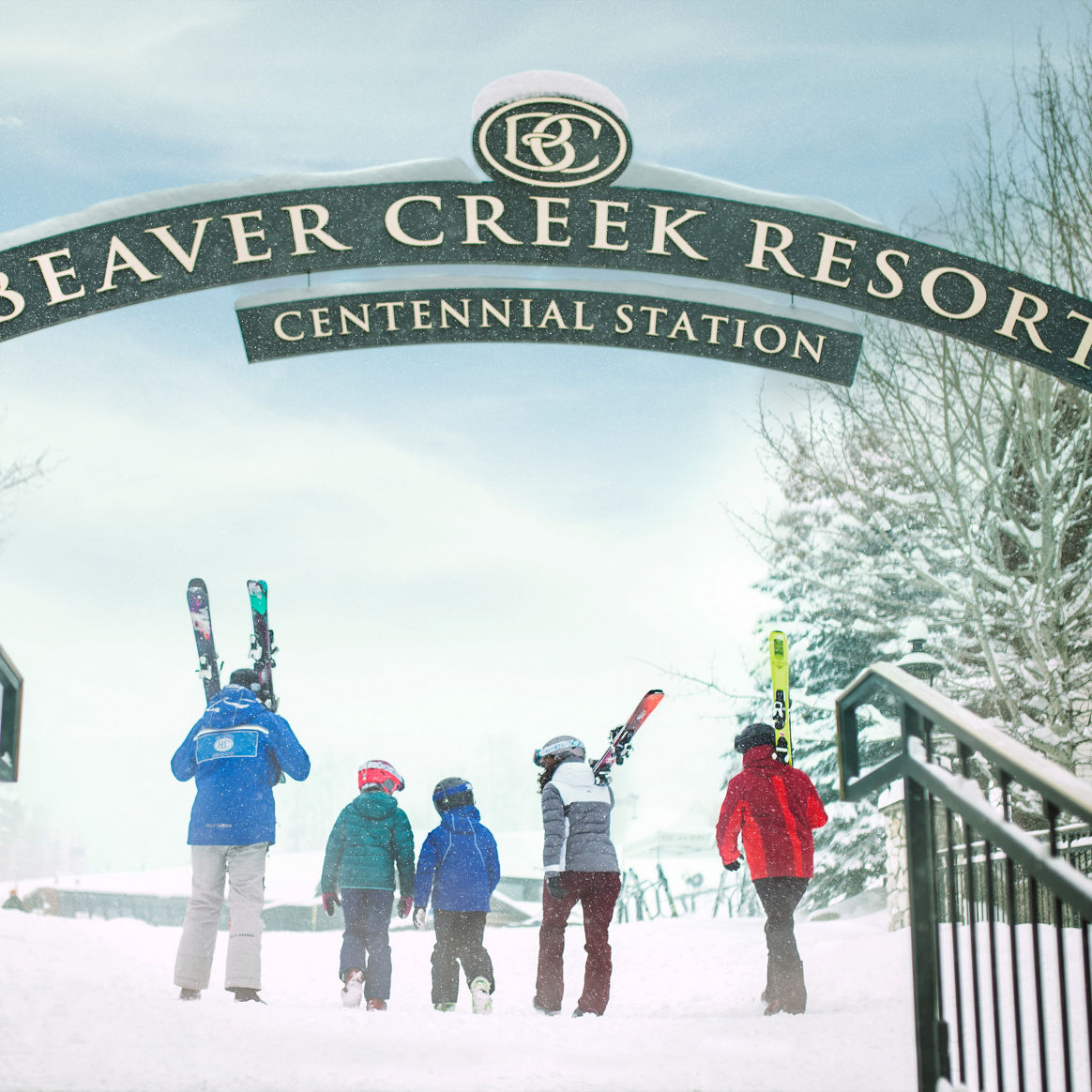 Ski ambassador escorts a family to the chairlift in Beaver Creek, CO.