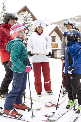 Family receives hot cookies after skiing in Beaver Creek, CO.