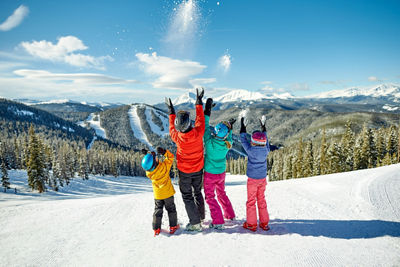 A family takes in the scenery and enjoys a day of skiing in Keystone, CO.