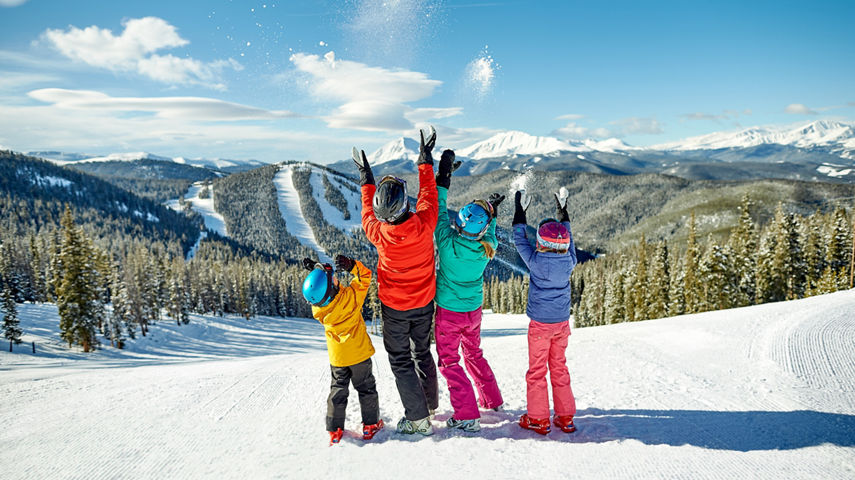 A family takes in the scenery and enjoys a day of skiing in Keystone, CO.