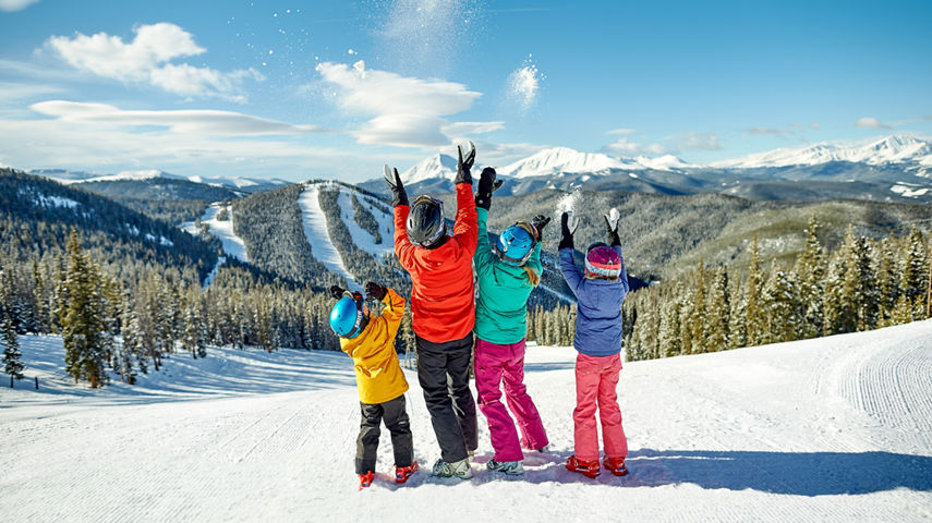 A family takes in the scenery and enjoys a day of skiing in Keystone, CO.