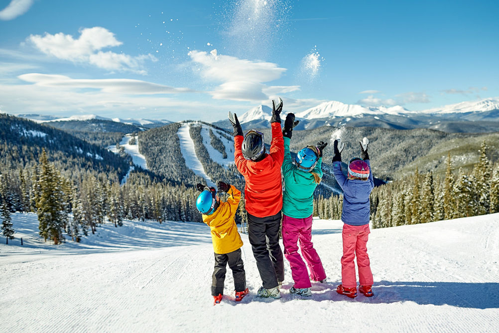 A family takes in the scenery and enjoys a day of skiing in Keystone, CO.