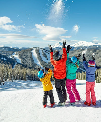 A family takes in the scenery and enjoys a day of skiing in Keystone, CO.