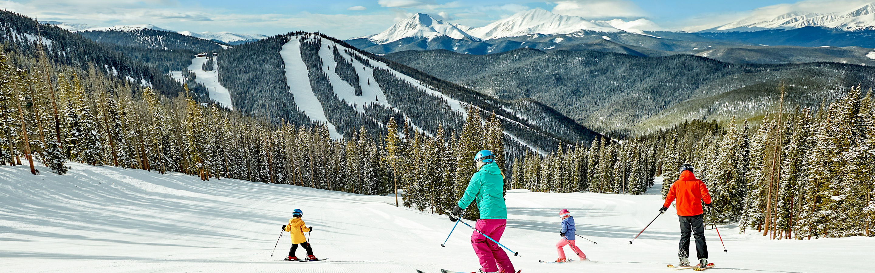 A family takes in the scenery and enjoys a day of skiing in Keystone, CO.