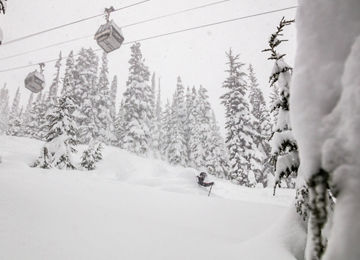 Keaton Carlson Skiing Powder underneath Whistler Village Gondola