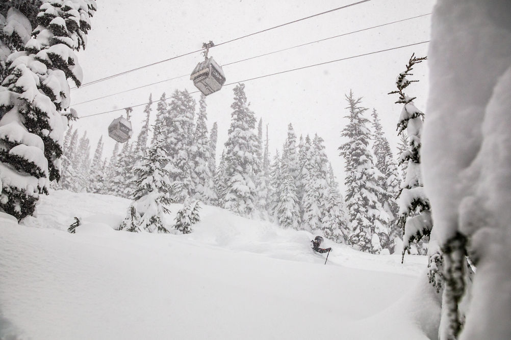 Keaton Carlson Skiing Powder underneath Whistler Village Gondola