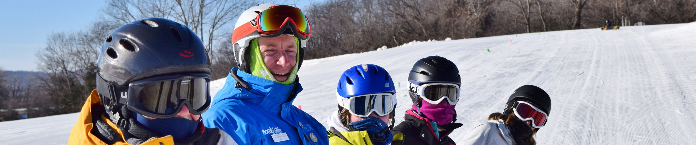 Ski Instructor Poses with Ski Lesson Group at Snow Creek