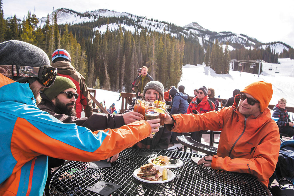 Friends enjoy apres after skiing in Crested Butte, CO.
