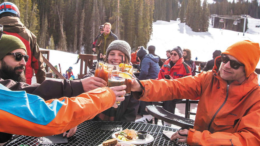 Friends enjoy apres after skiing in Crested Butte, CO.
