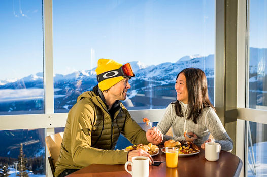 Family enjoying complimentary breakfast with the Fresh Tracks program in Whistler Blackcomb.