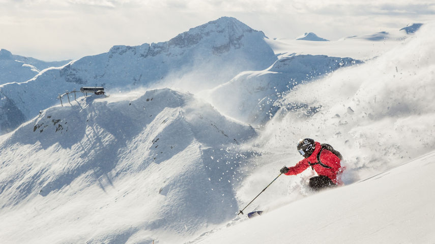 Mandin Jules Skiing Whistler with Symphony Chair in background