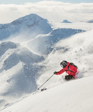Mandin Jules Skiing Whistler with Symphony Chair in background