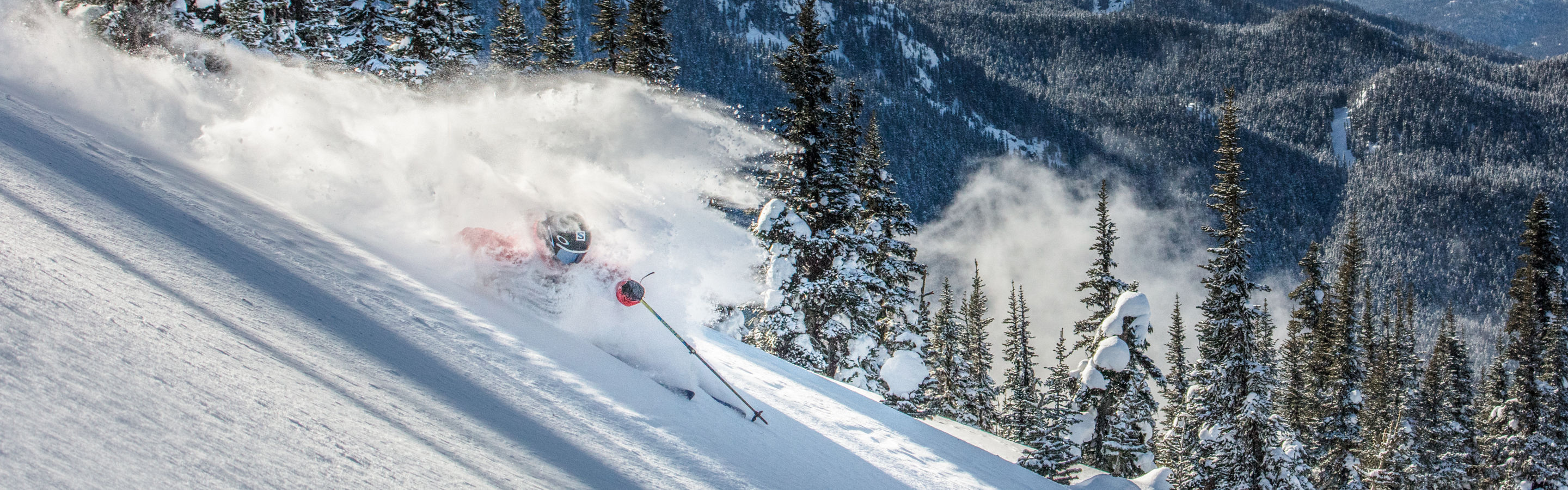 Mandin Jules Skiing Powder with Tantalus Mountain Range in background