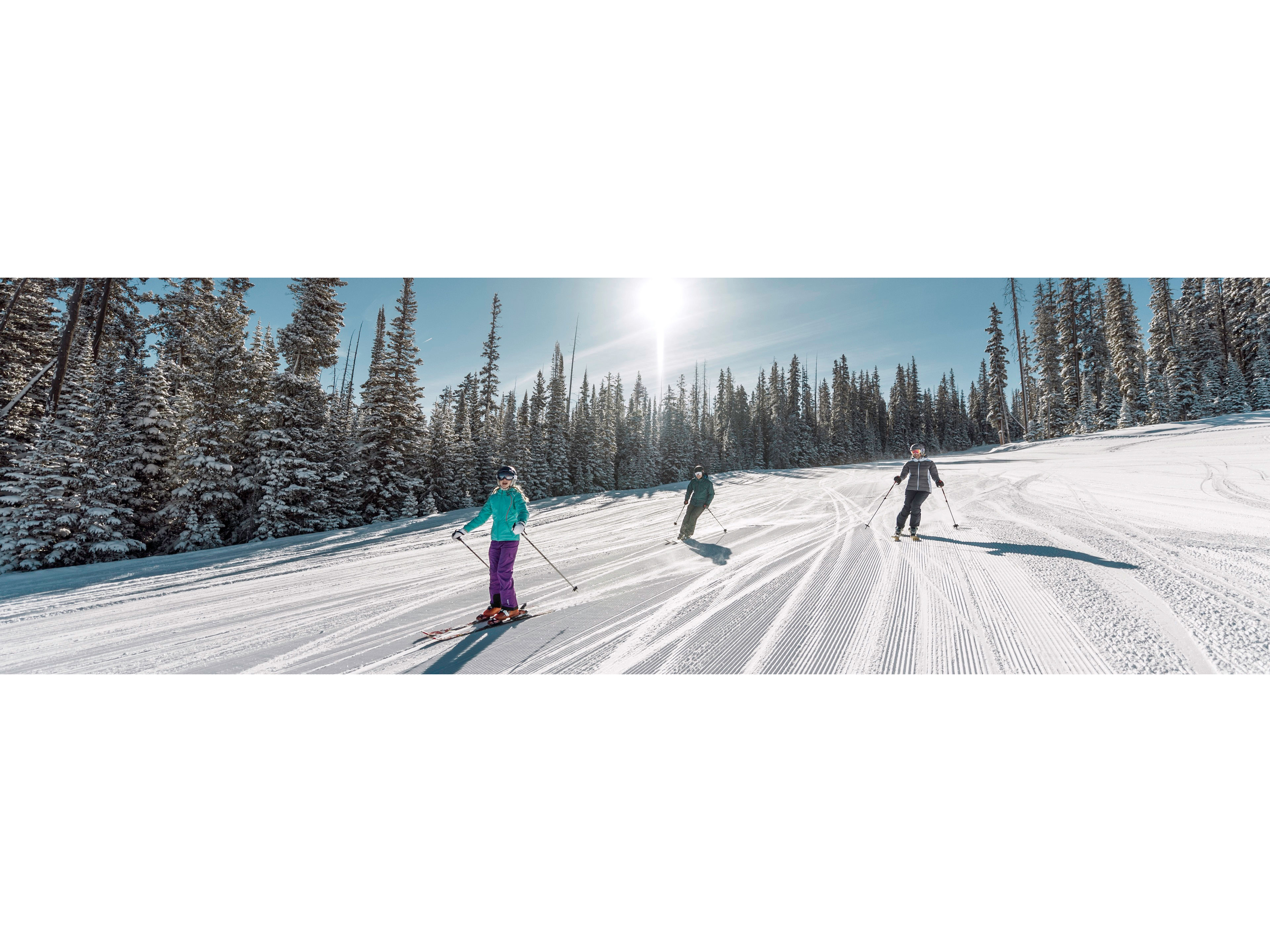 Family skis in Red Buffalo Park adventure zone in Beaver Creek, CO.