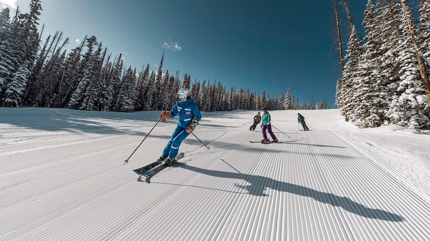Family skis in Red Buffalo Park adventure zone with instructor in Beaver Creek, CO.
