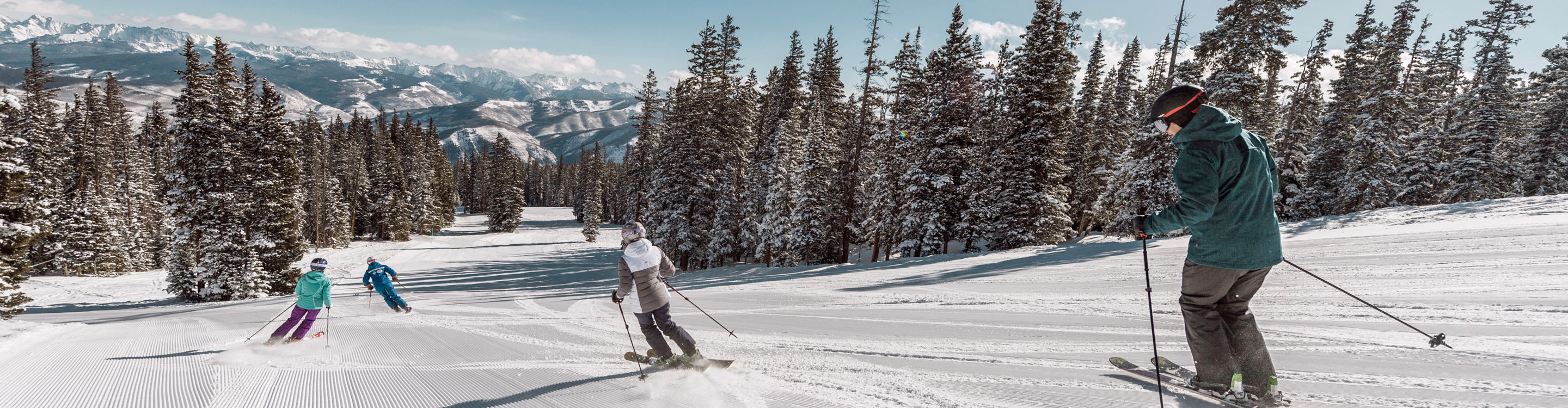 Family skis in Red Buffalo Park adventure zone with instructor in Beaver Creek, CO.